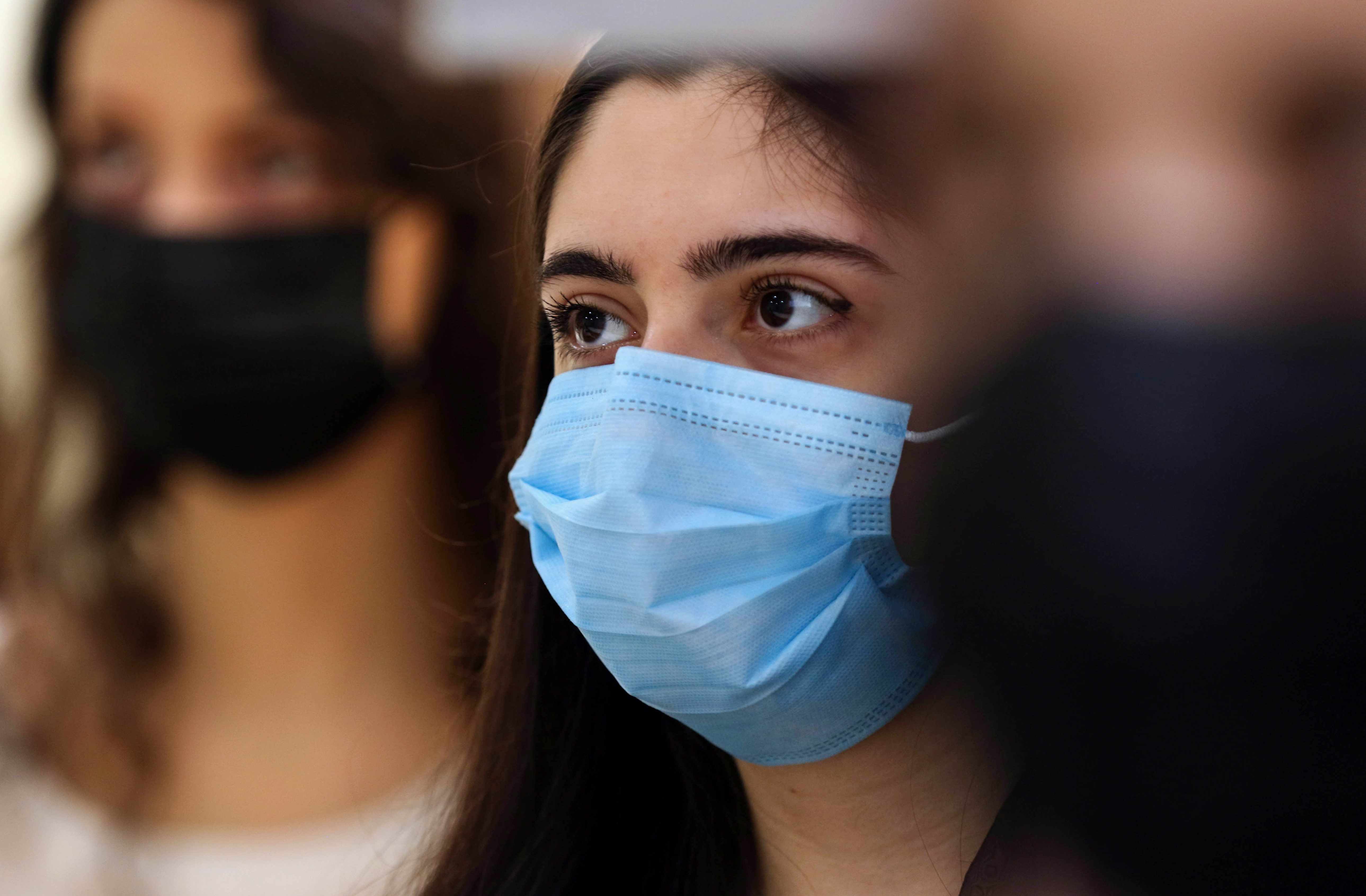 A mask-clad female student during a lecture on the first day of the new school year in the Kurdistan Region amid the coronavirus pandemic, Sept. 27, 2020. (Photo: AFP/Safen Hamid)